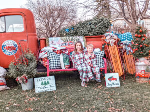 2021 holiday extravaganza two kids at the red truck